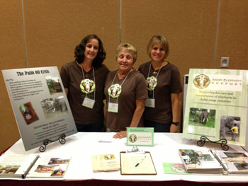 Directors April, Linda, and Sharon at the display table 