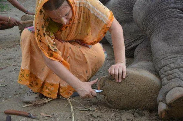 Ms. Dasi performing foot work on one of the girls