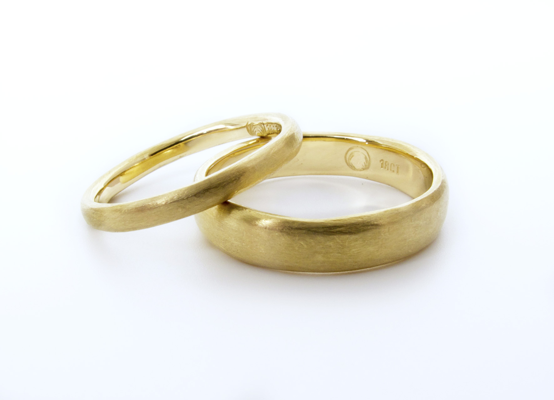And from the same job, the two his & hers wedding bands pictured on their own, 18ct yellow gold with a soft organic texture.
