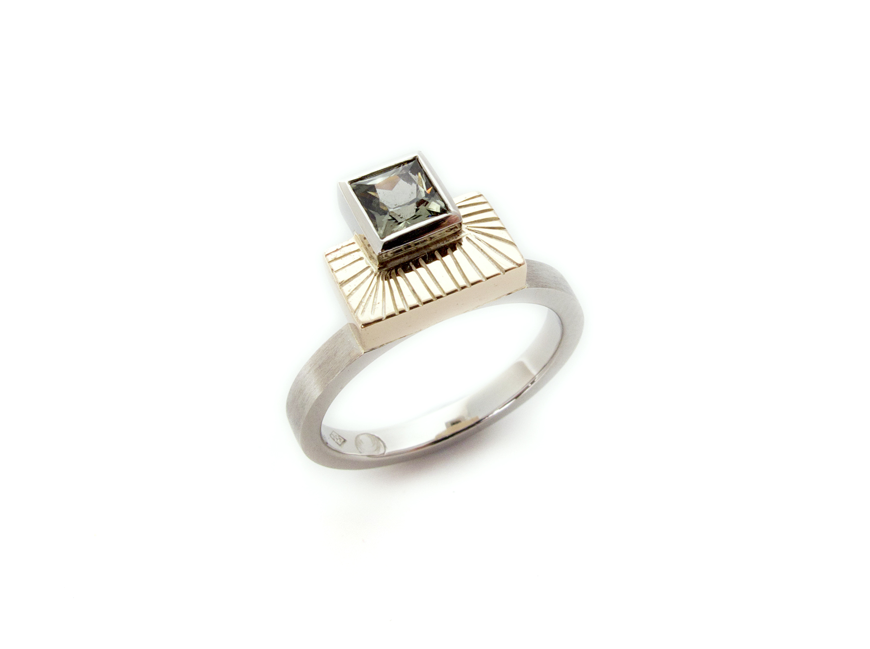 This modern art deco inspired engagement ring featured a smokey sage Australian green sapphire, and was made in platinum with the customers own recycled heirloom yellow gold.