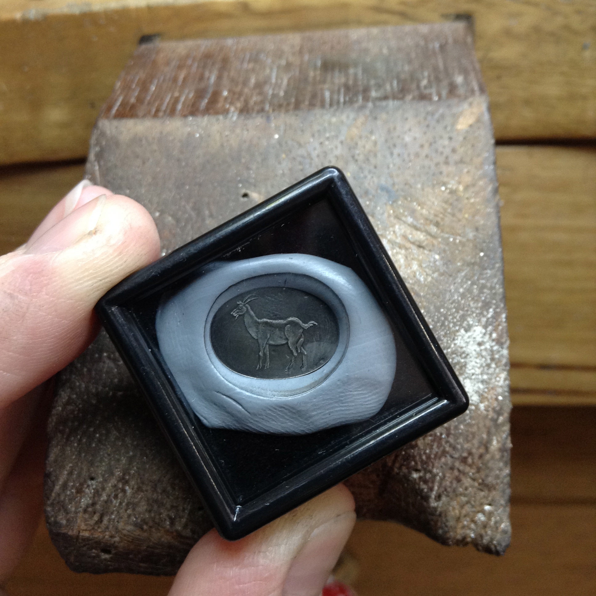 the wax seal impression of the hand engraved horned goat