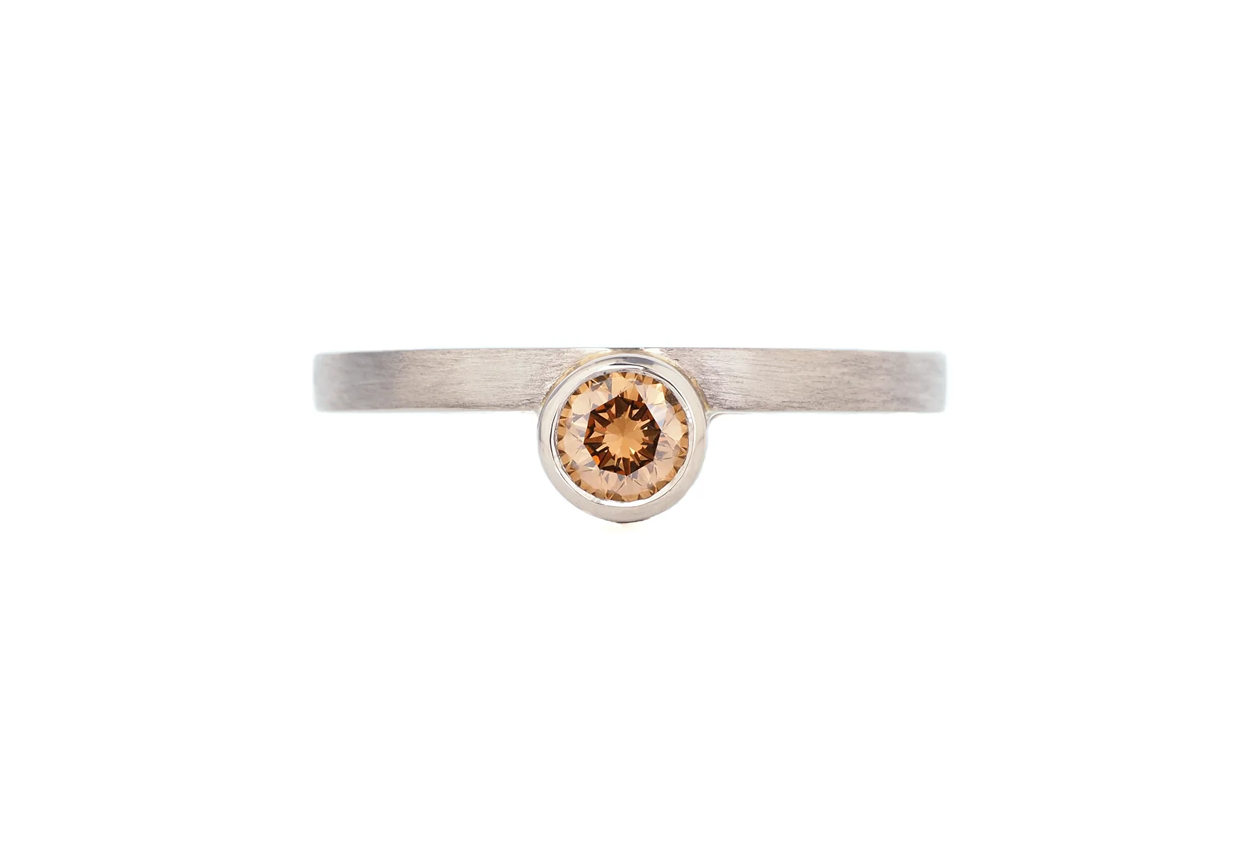 offset bezel ring, Australian Argyle champagne diamond in 18ct white gold
