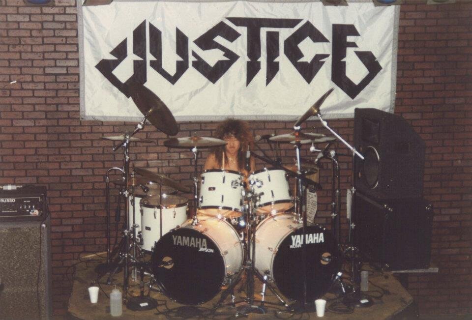 A young 16 year old Jayson on the drums for Justice.