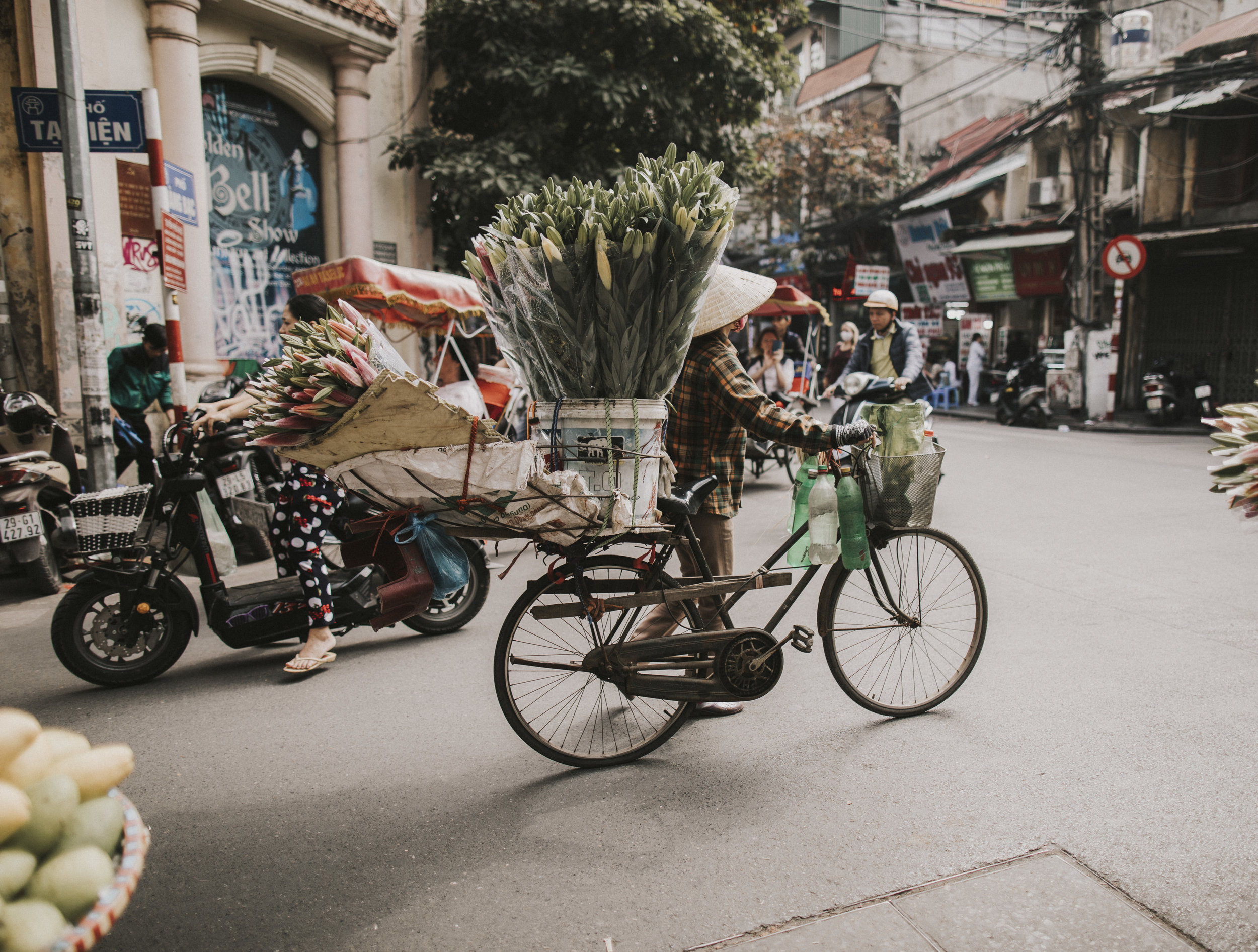 Travelling through Hanoi with flowers