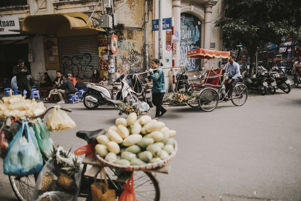 Crossing the road with fruit and veg.