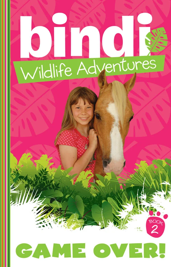 Bindi Wildlife Adventures 2: Game Over! Bindi and her South African friend, Hannah, are on a horse-riding trek of a lifetime in South Africa, when they discover that the supposed breeding sanctuary for the giant sable antelope is actually looking more like a game reserve for rich tourists with big guns. But the girls get found out spying, and may not get a chance to tell anyone what’s really going on!