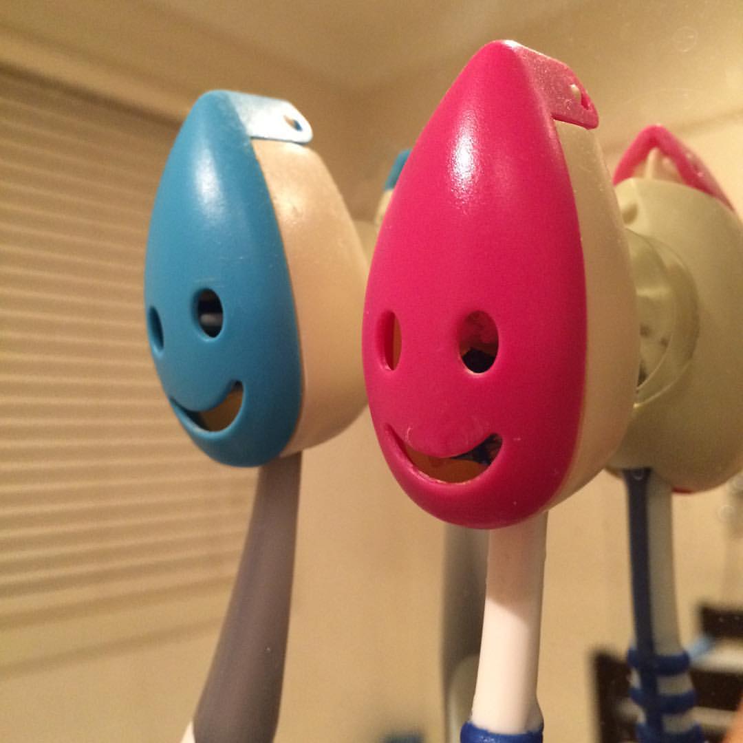 Blue and red toothbrush holders