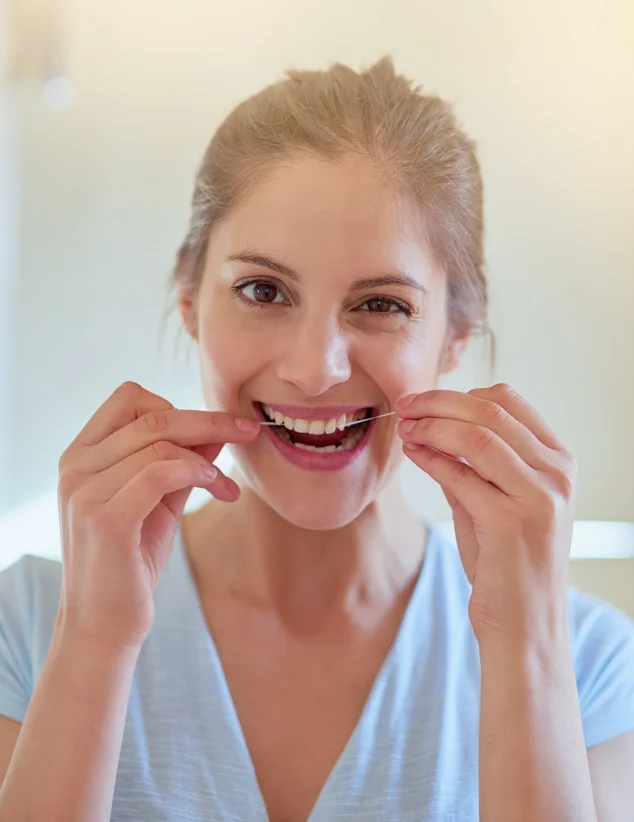 Girl flossing