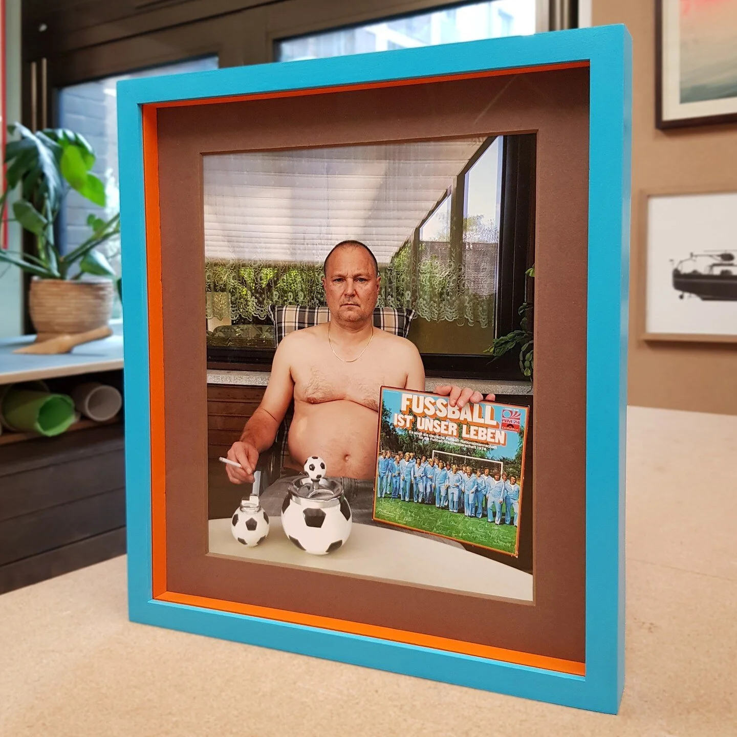 ⁠
Frame: tulip frame painted blue - brown window mount - orange fillets - anti-reflect glass⁠
⁠
This was a fund project to work on. The client wanted this Juergen Teller photograph to have a playful frame so we matched the colours of the frame and fi