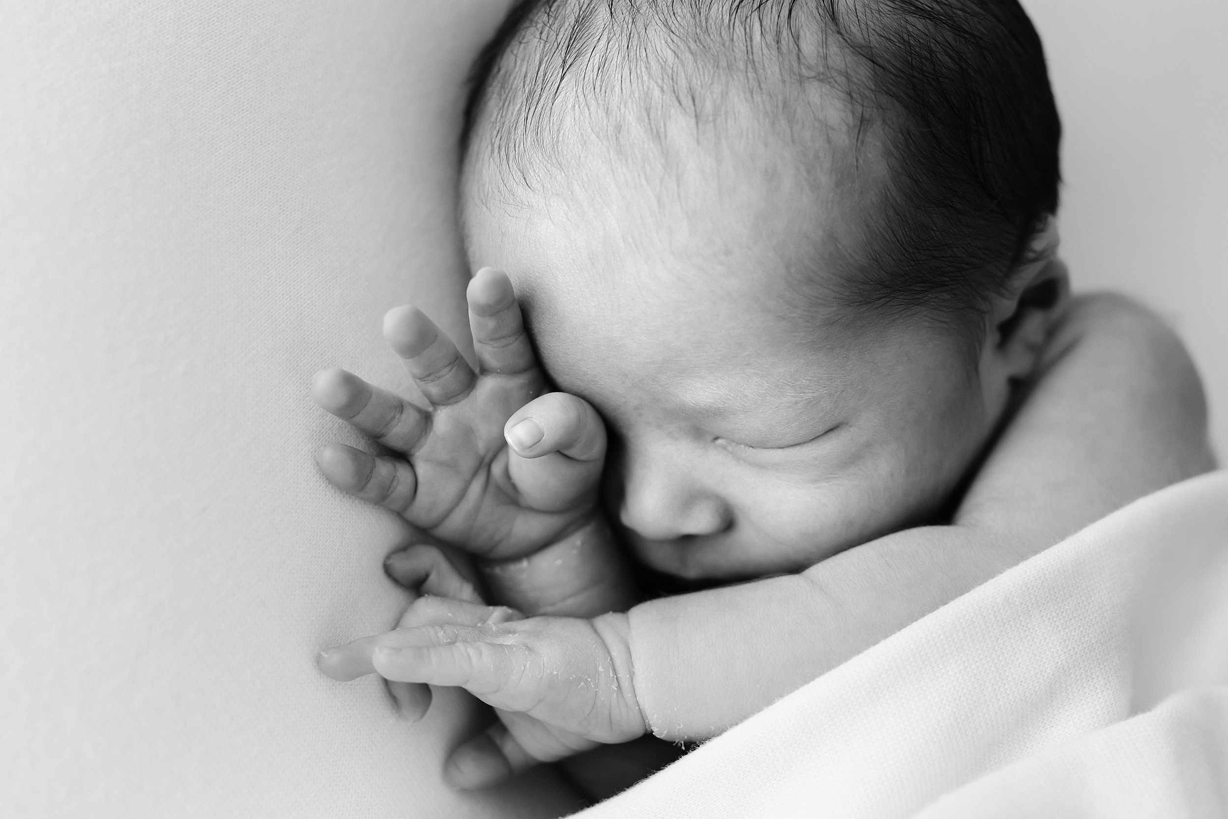 Black and white photo of a baby waking up during a photo shoot in Melbourne