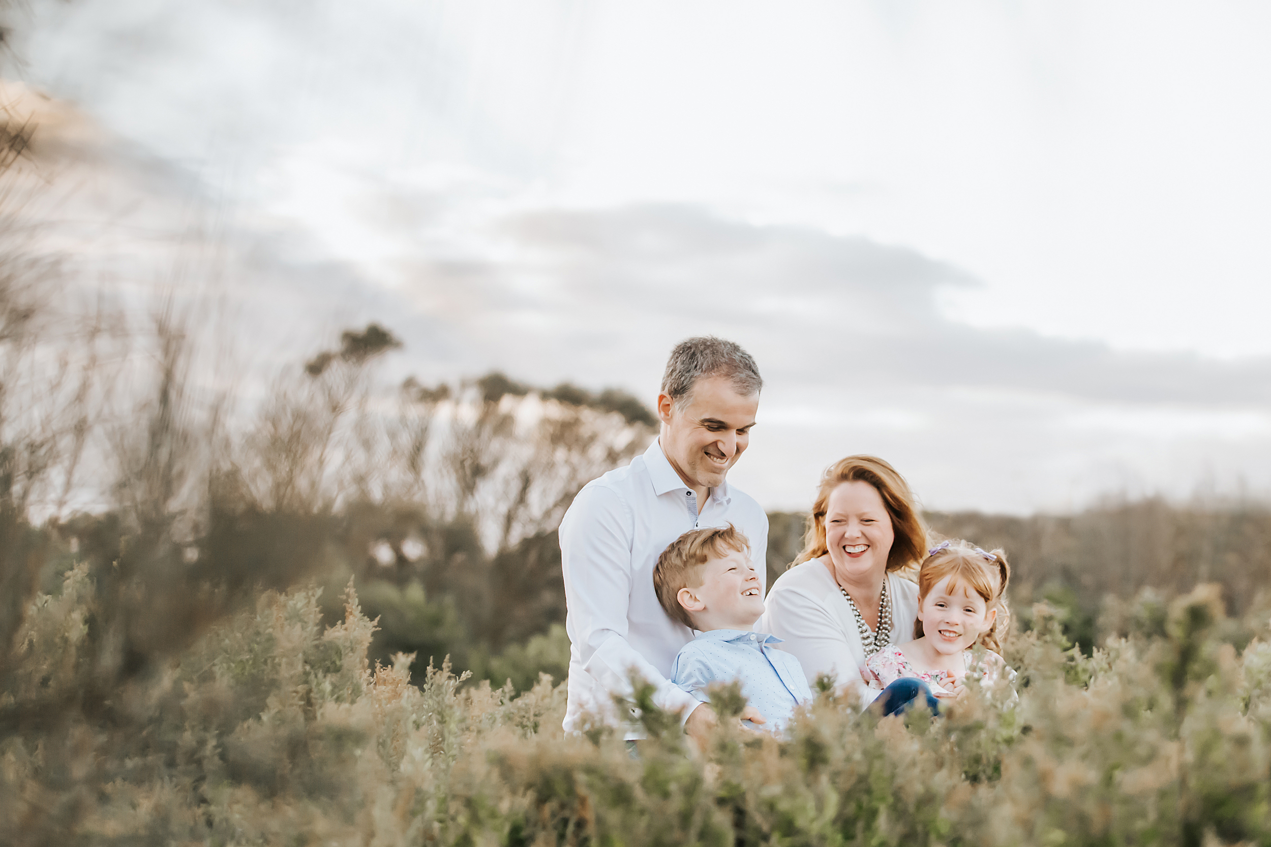 A candid photo of a family of four taken during a family photography session in Melbourne