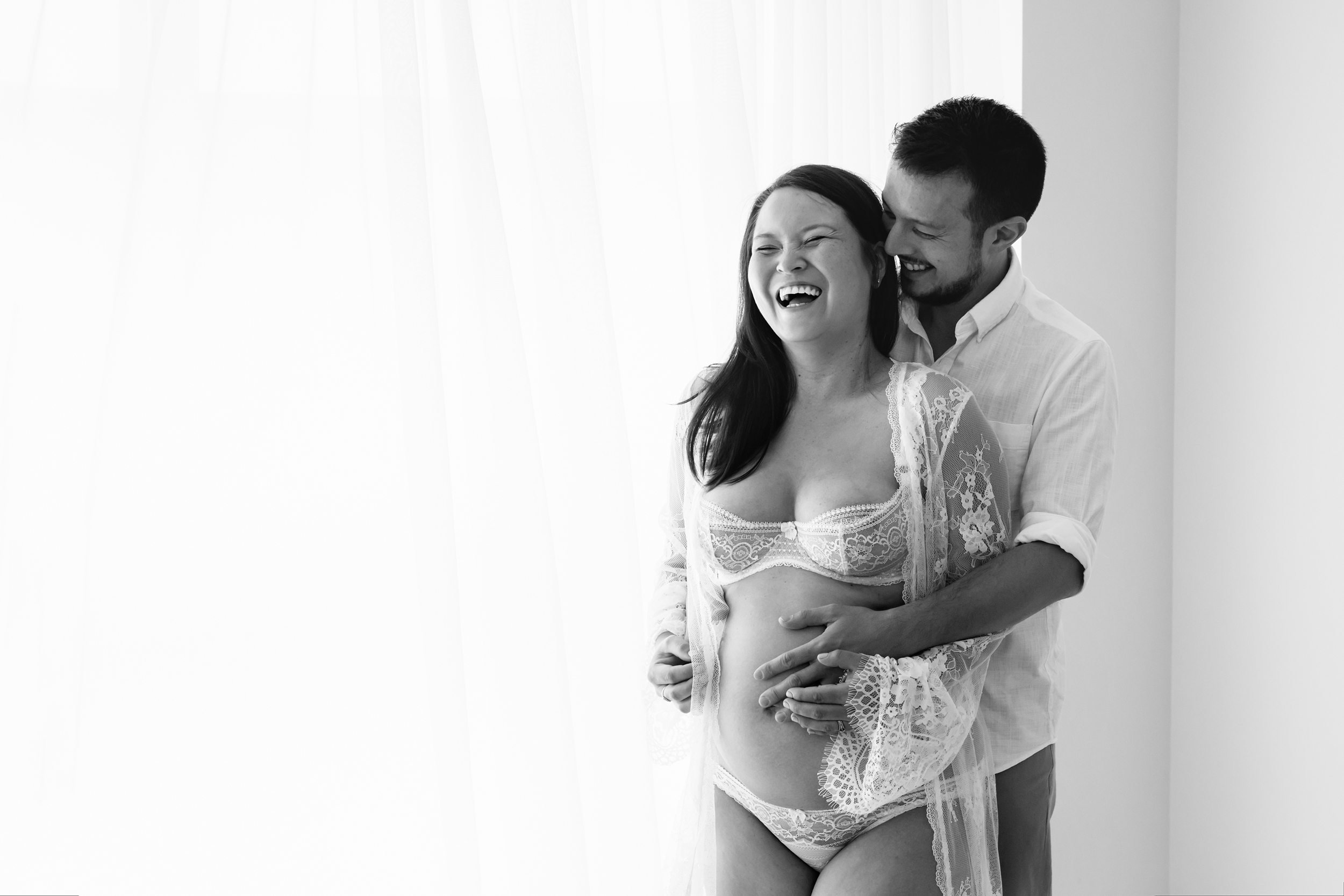 Black and white photo of couple expecting their second baby taken during pregnancy photography session in Melbourne