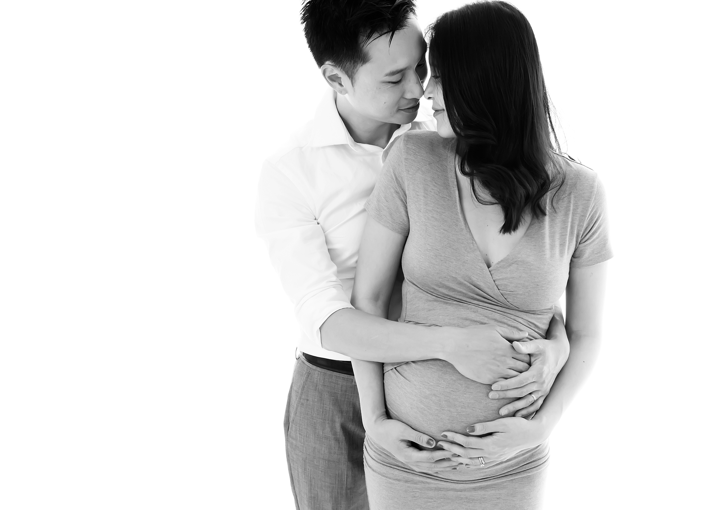 A natural photo of a new mum and dad during their maternity photo shoot in Melbourne
