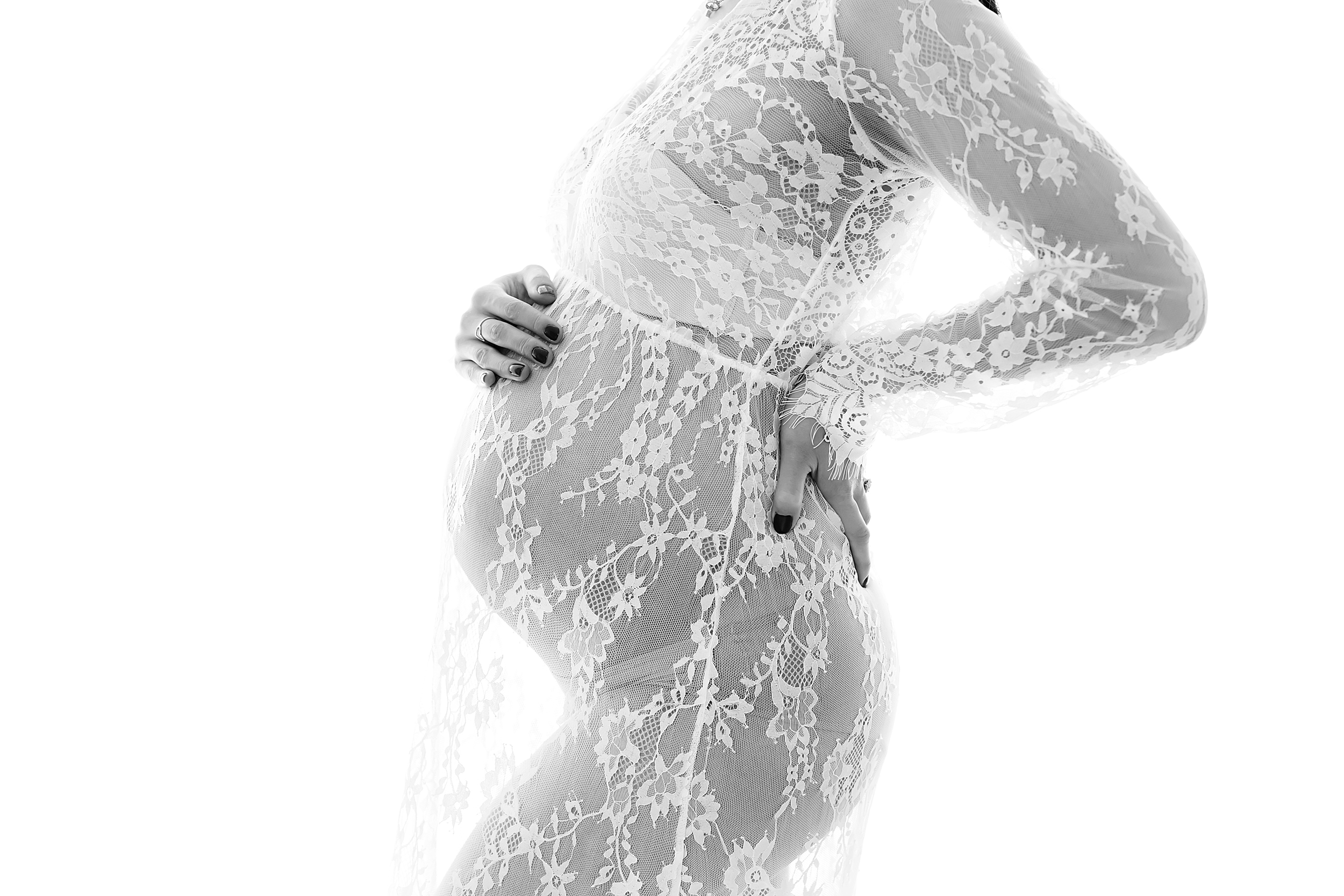 Black and white, close up photo of pregnant woman in her third trimester taken using natural light taken by Melbourne maternity photographer