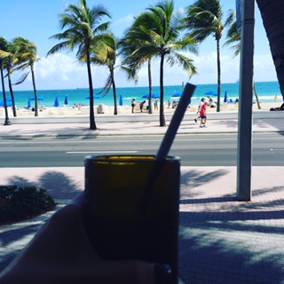 Iced Coffee with a splash of almond milk beachside