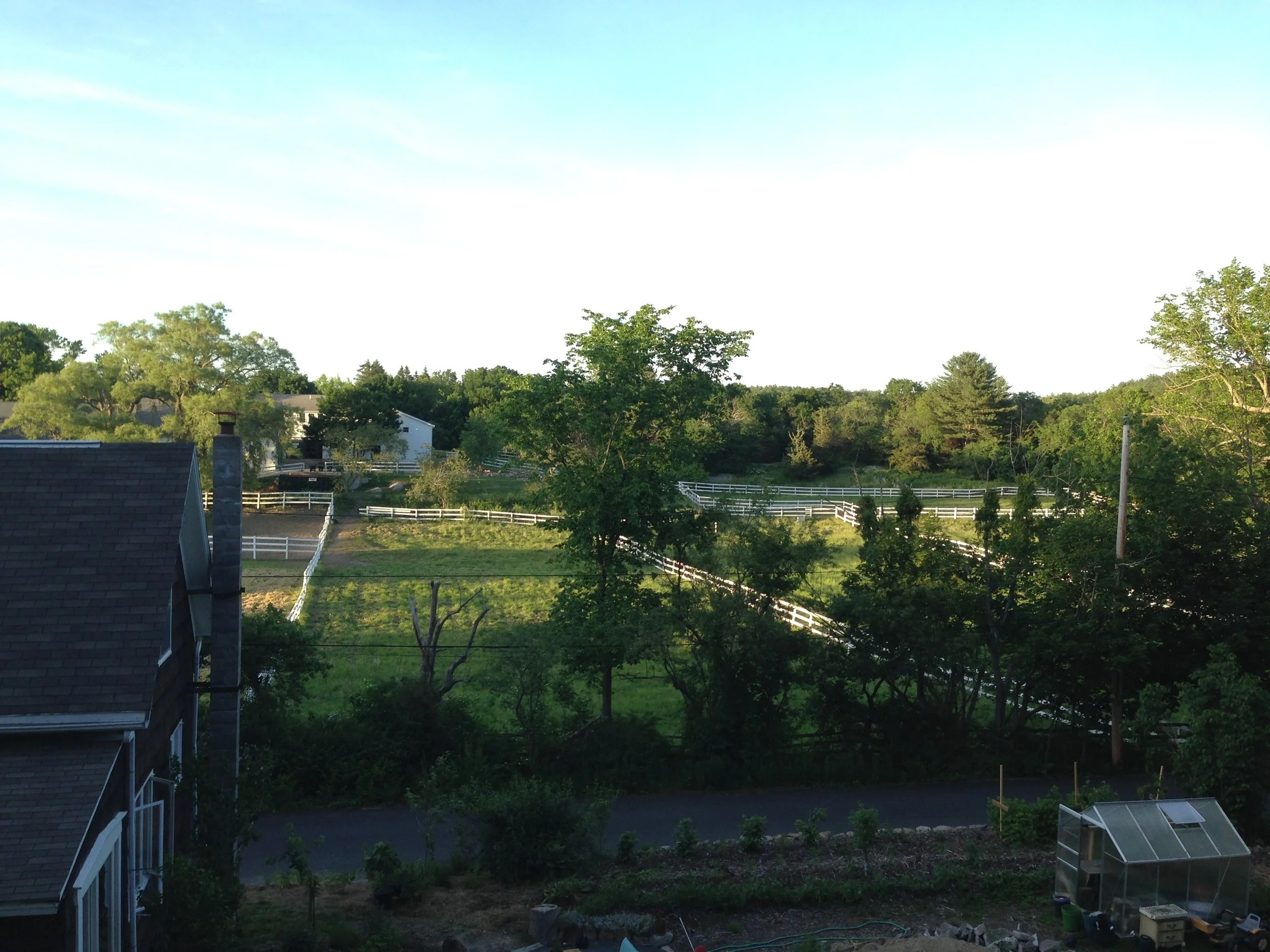 August 2017 View from up slope, down at the property and at the farm across the road.
