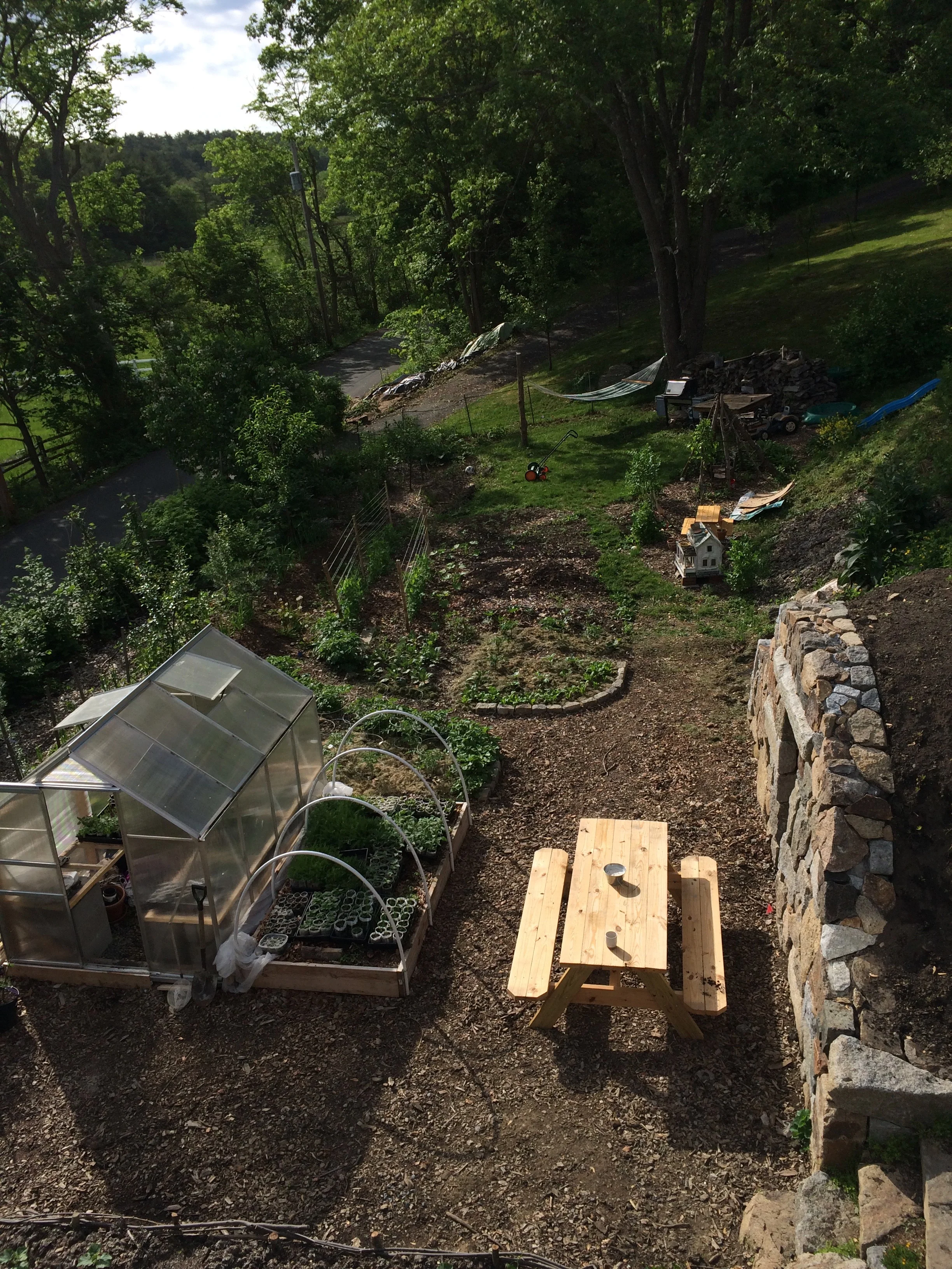 May 2018 A few weeks later, the gardens are just coming in, the root cellar is so close to being done…
