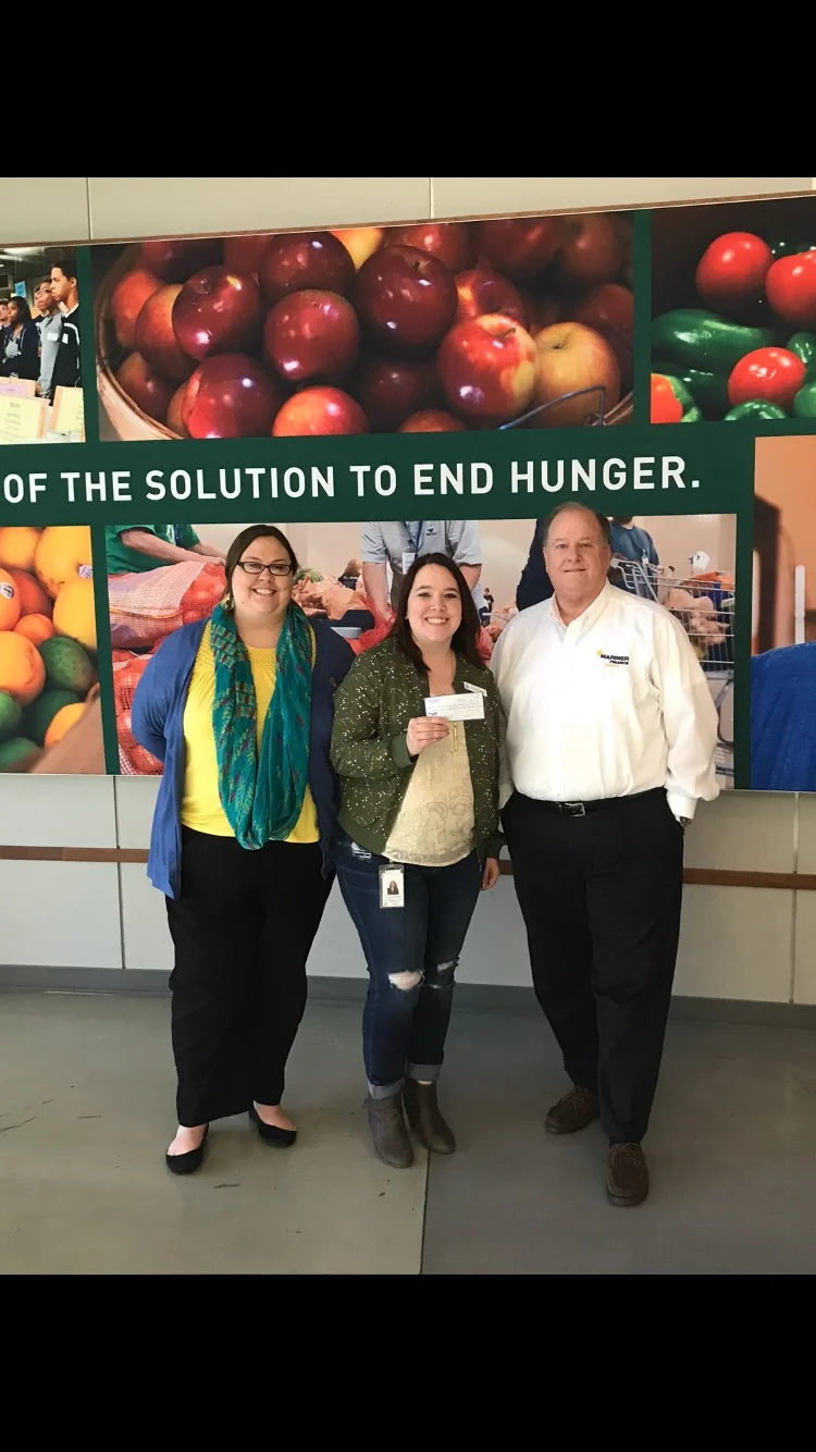 Pictured are Anne Rodriguez and Phillip Nevils of Mariner Finance delivering a $1,500 donation to the Second Harvest Food Bank of Middle TN on December 12, 2017. Amanda M. Richard (Pictured center, Corporate Partnerships Manager of Second Harvest Food Bank) graciously accepted the donation. 