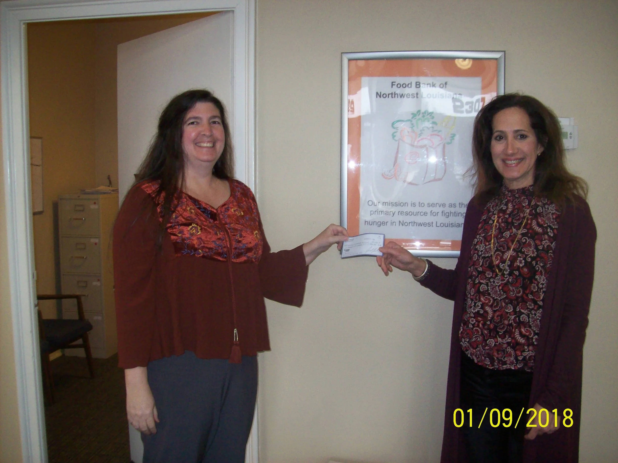 Pictured from left to right: Tammy Washington – Branch Manager of Mariner Finance in Shreveport, LA; Meg Coleman – Development Director of Food Bank of Northwest Louisiana