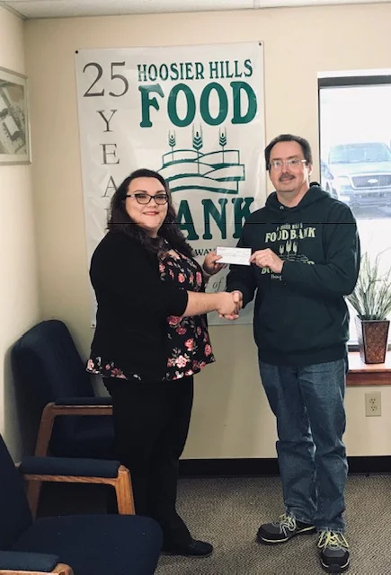 Pictured from left to right: Krista Rector, Branch Manager of Personal Finance Bloomington, IN location, Julio Alonso, Executive Director of Hoosier Hills Food Bank