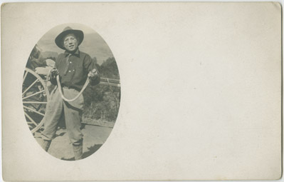 Tom Gatton with snake, location unknown, 1912