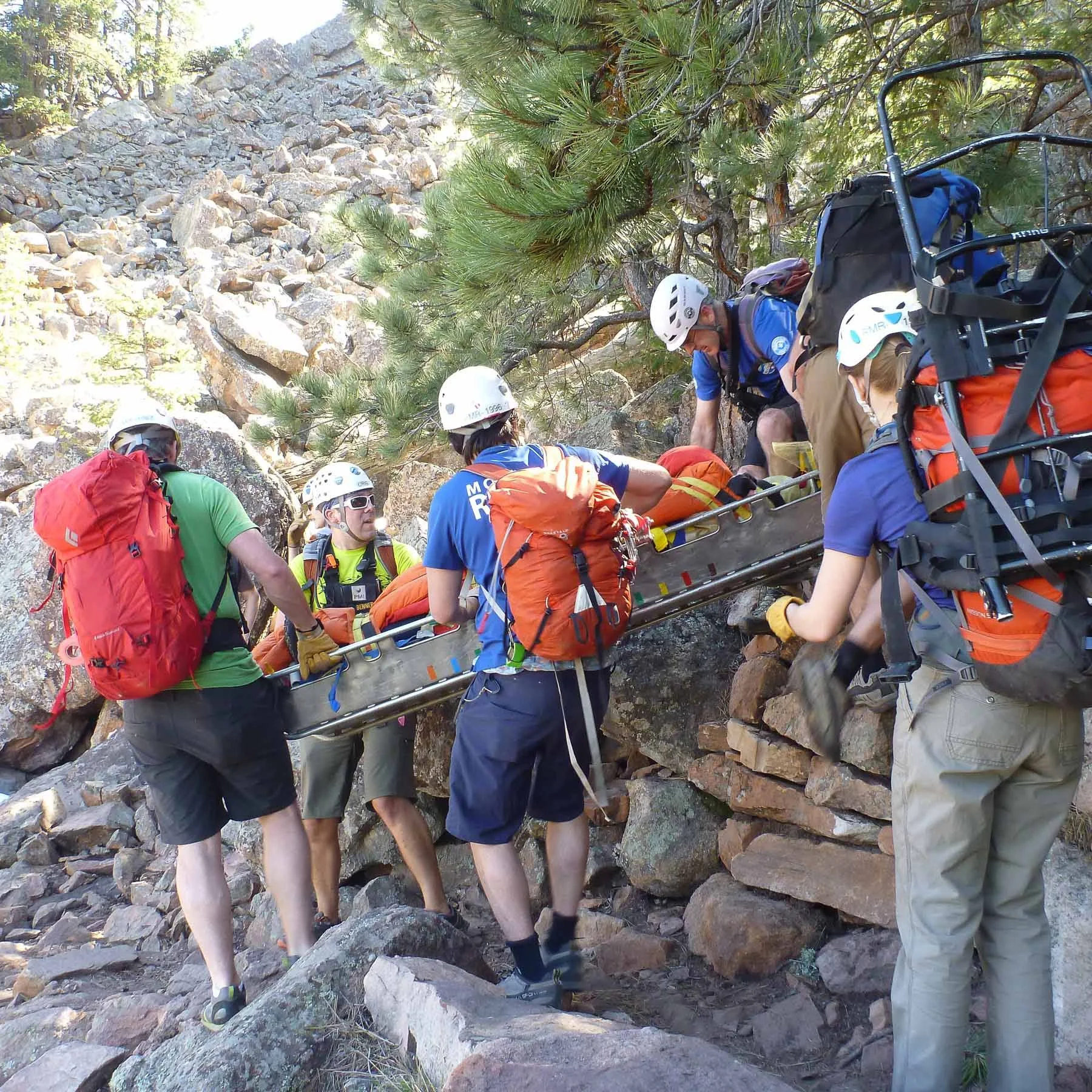 RMRG members approaching the lower scree field with rescued hiker securely in the litter. 