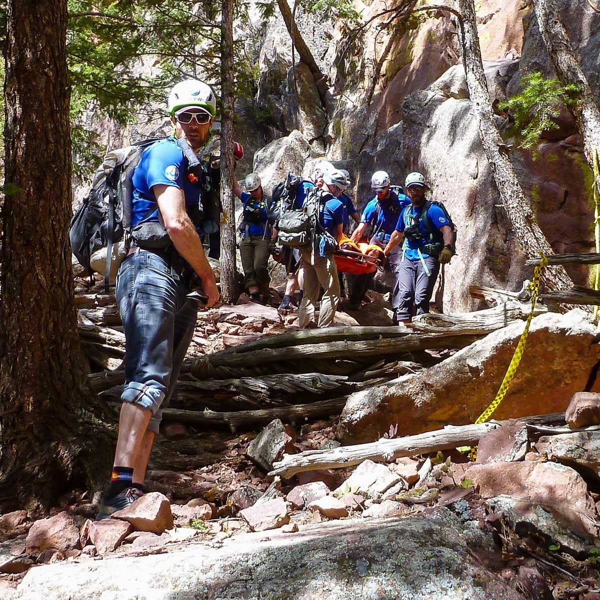 Looking up at "scree" evacuation of climber in litter