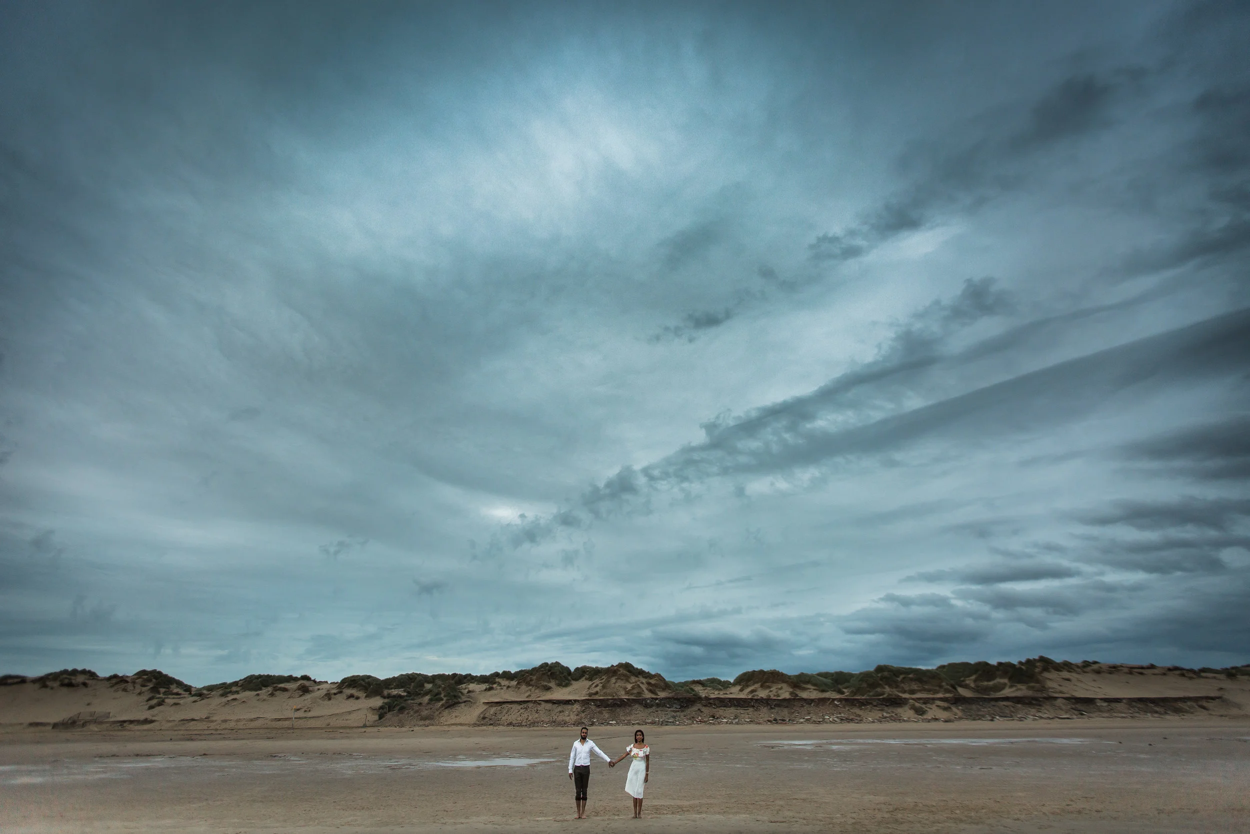 Blessed with dramatic skies on the beach for Nieran and Dina's engagement shoot