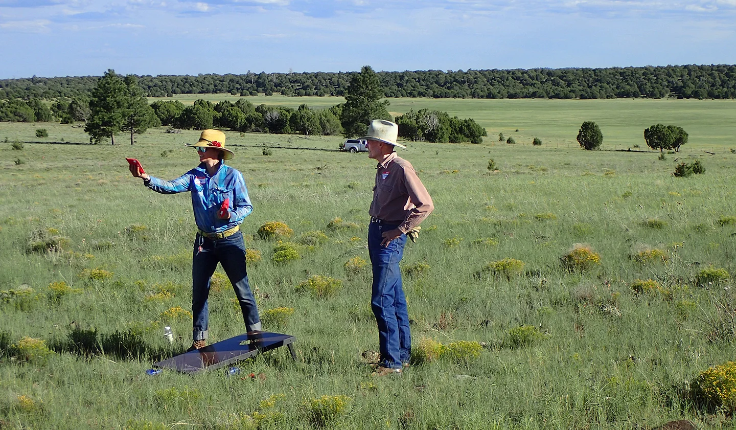 Stephen Williams (DT Board Member) playing cornhole with Molly (USGS).