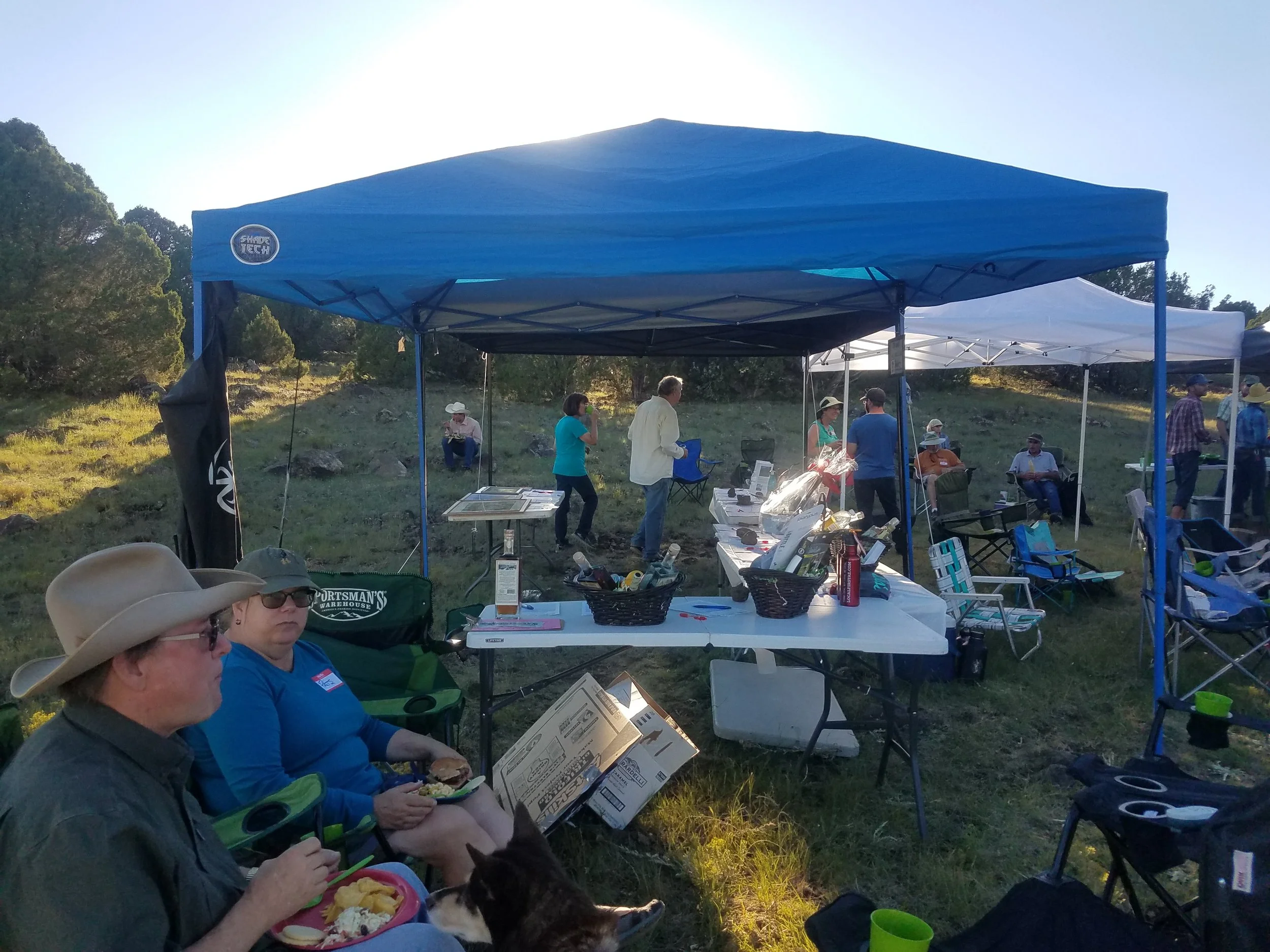 The Hargers eating beside the Silent Auction tents. (Photo by Jeremy Krones)
