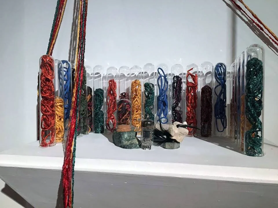 Sarah Walko Detail of Glass Orchestra (holding together the worn down mountains and rivers themselves, listening to an ancient promise) 2017 Test tubes, thread, t-pins, plexiglass, slate, mixed media Dimensions variable Courtesy of the artist
