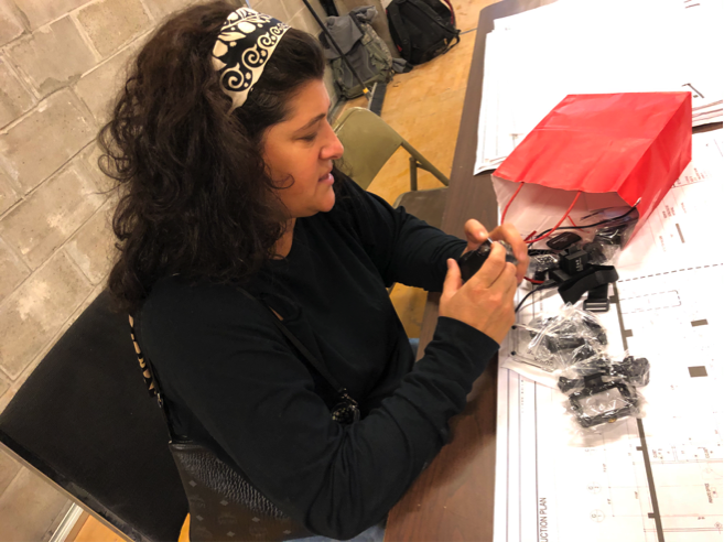 Gianna, trying to put the GoPro camera together