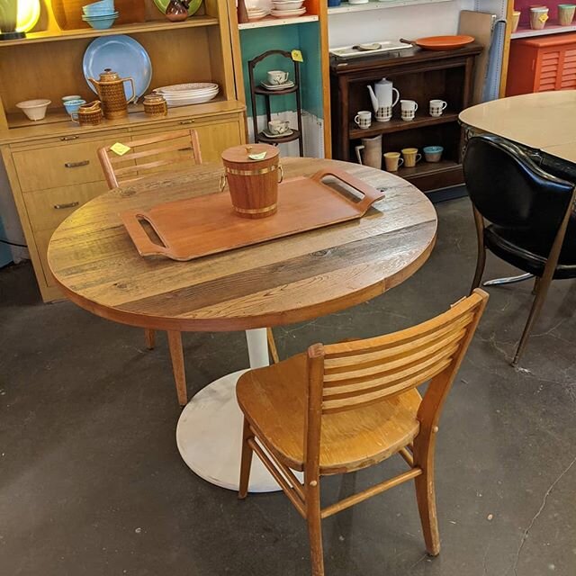 Round reclaimed wood dining table on a tulip base. Great for a dining nook or small apartment.