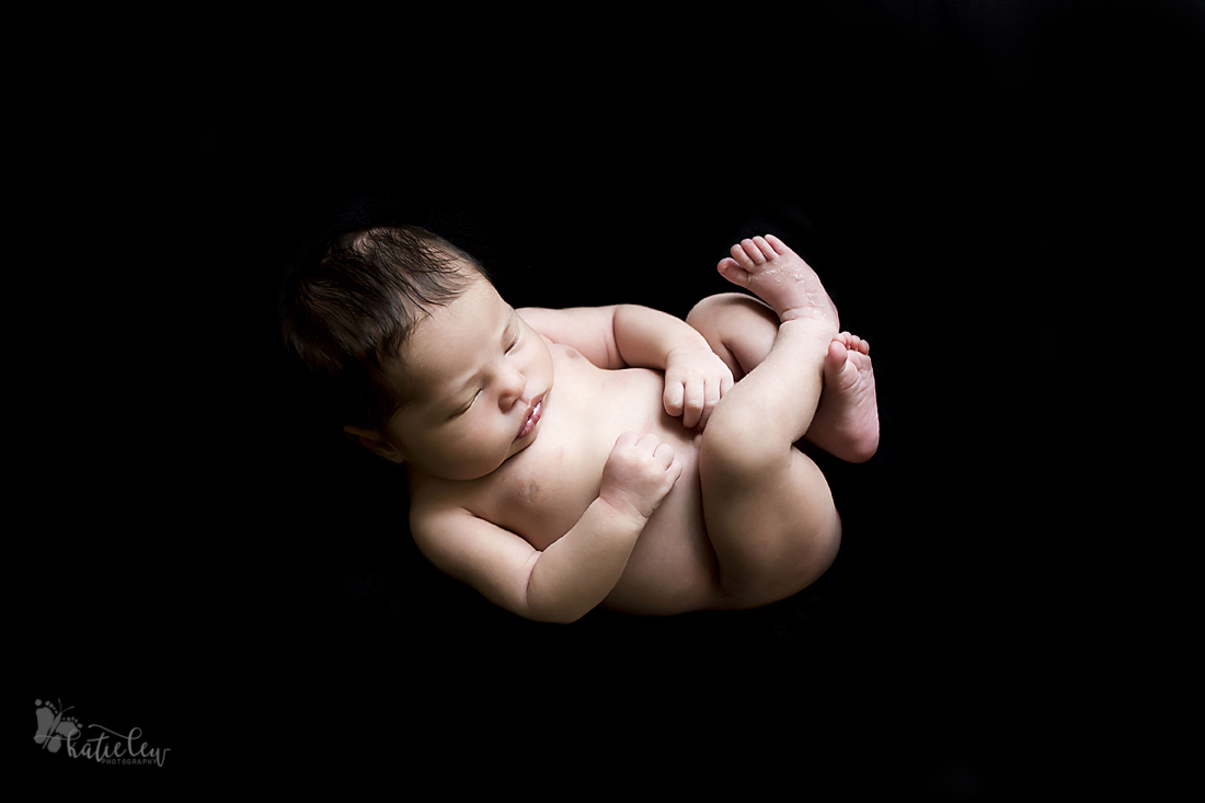 baby on black background