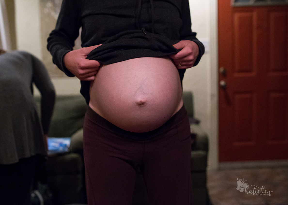 The mom's pregnant belly during labor