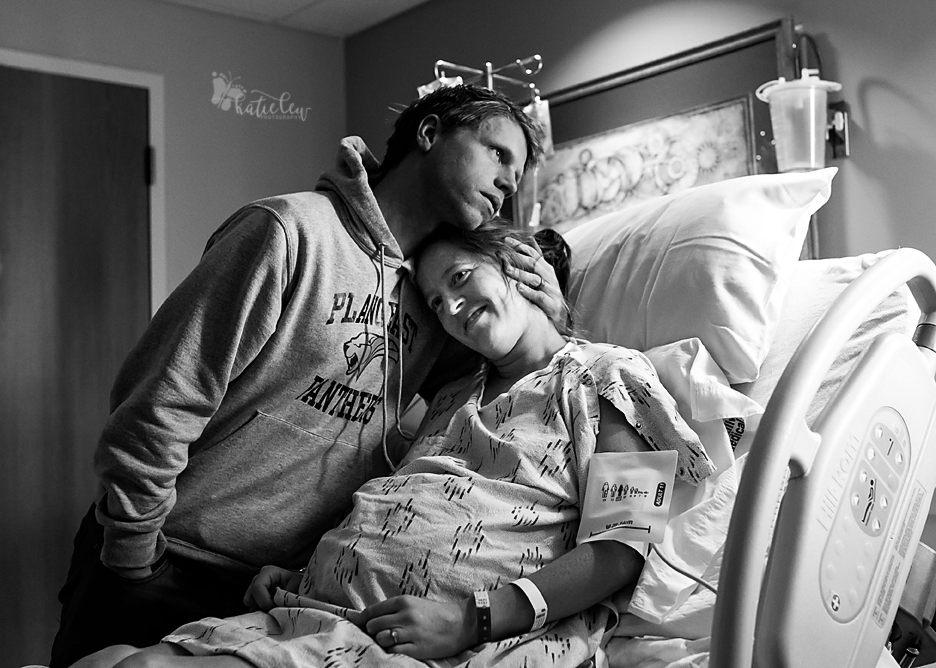husband hugs his wife before she goes back for a cesarean section at stillwater medical center