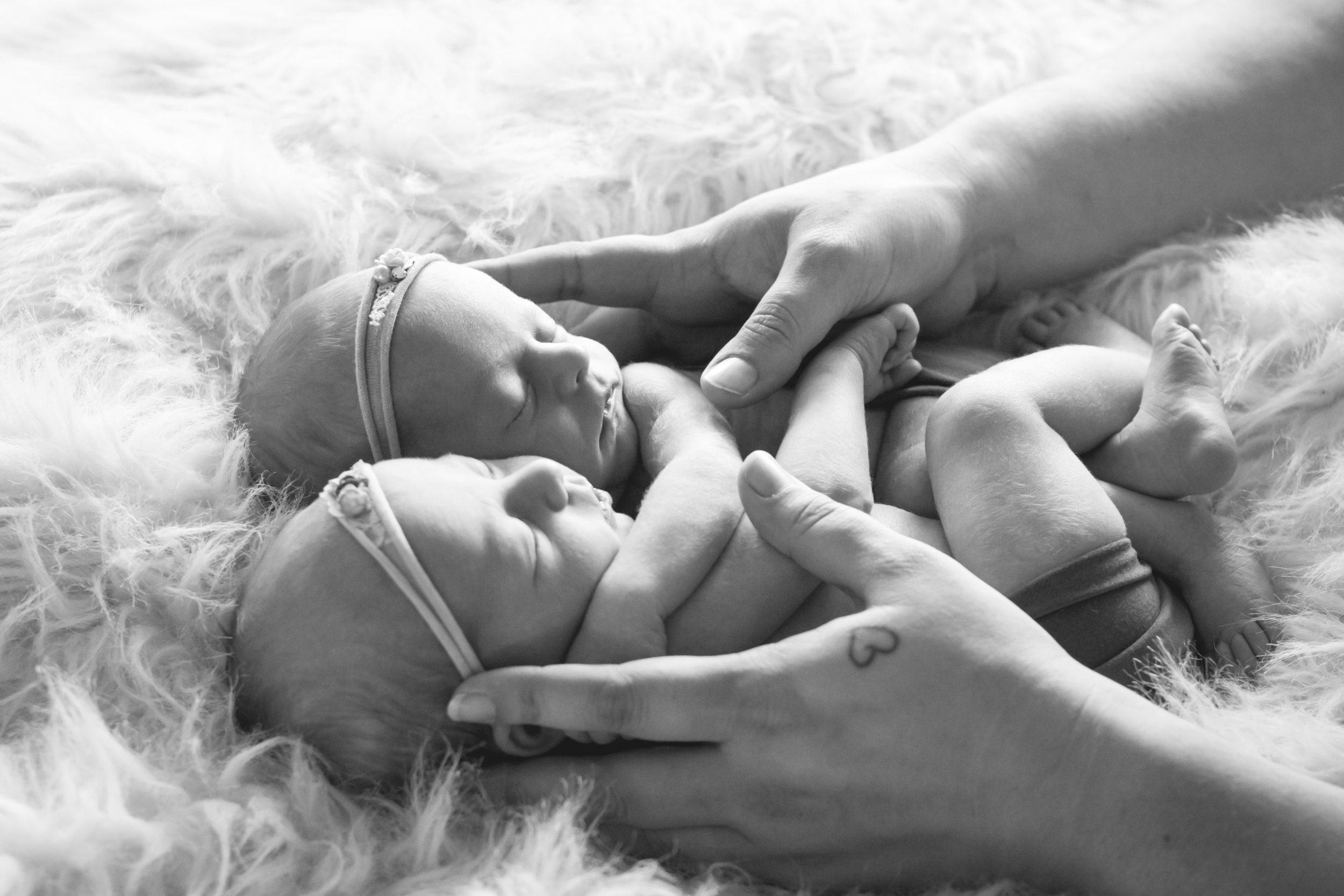 Katie of Katielew photography comforting twin baby girls