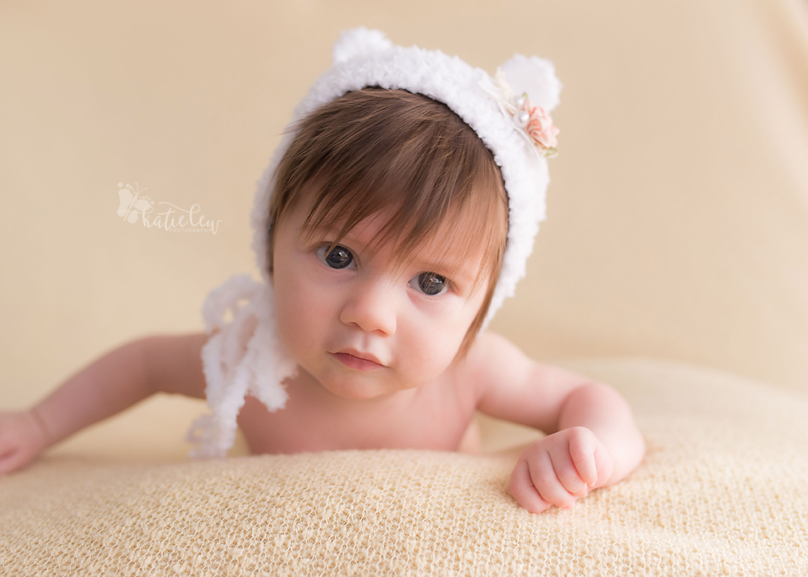 3 month old baby girl wearing a bear bonnet
