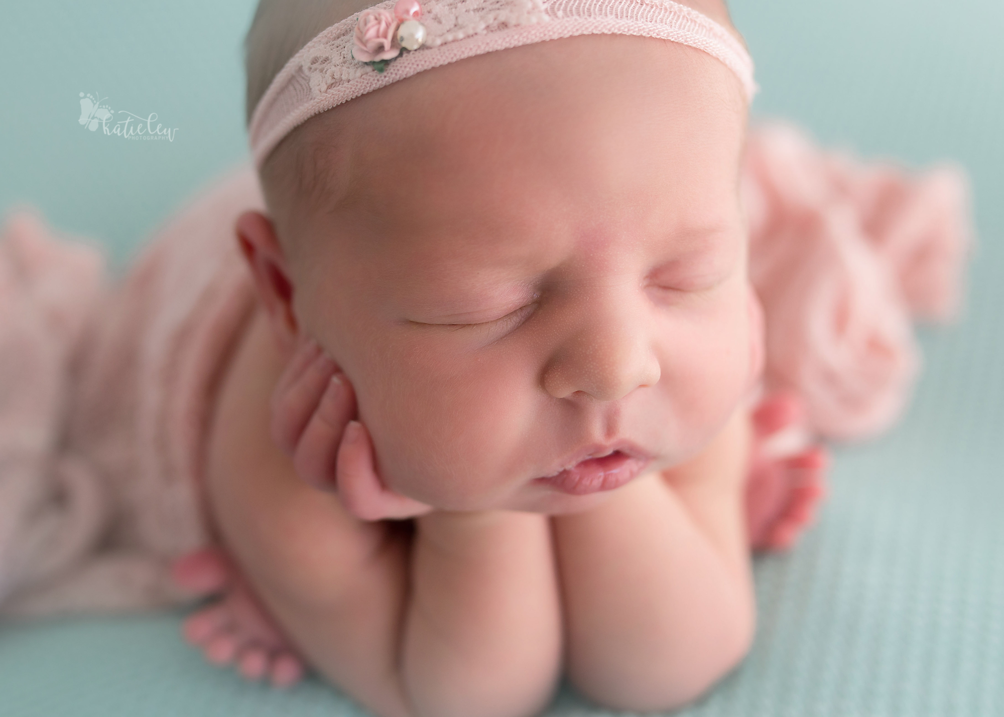 Up close picture of a tulsa born newborn girl in froggy pose.