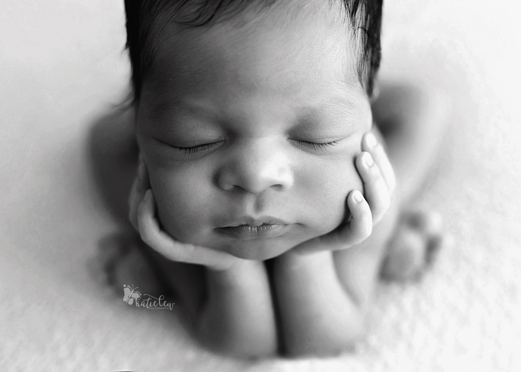 timeless black and white image of baby girl in froggy pose