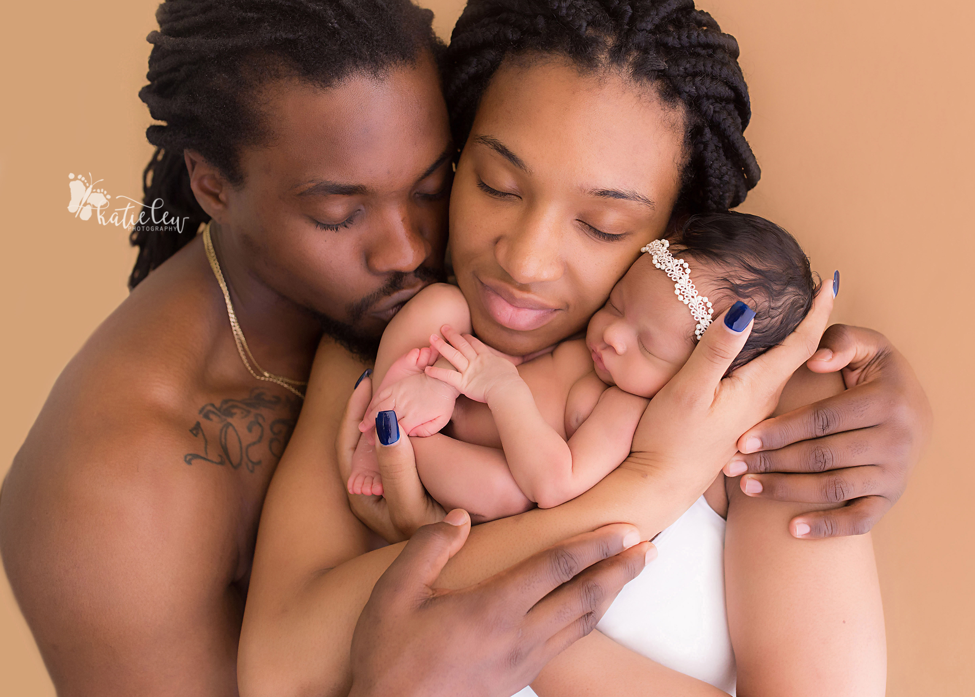 timeless image of a couple with their newborn baby