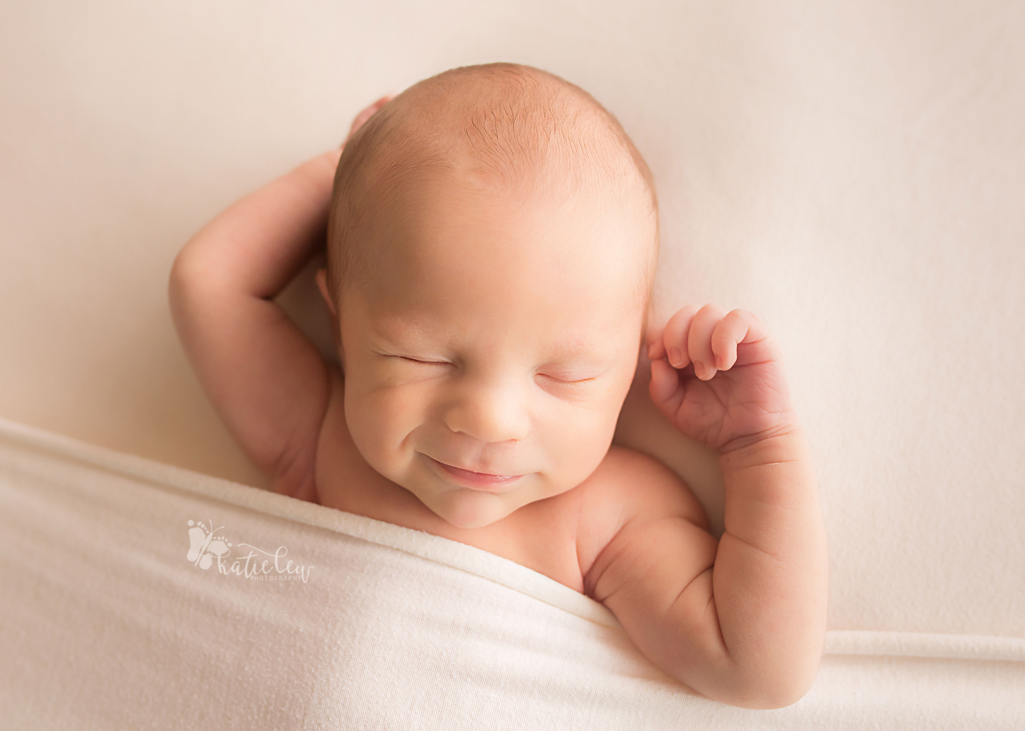 sweet smiling newborn baby boy