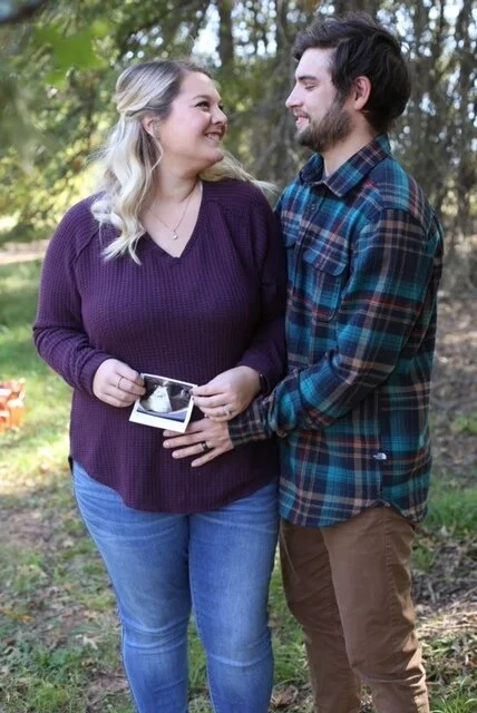 expecting woman and man sharing their ultrasound picture
