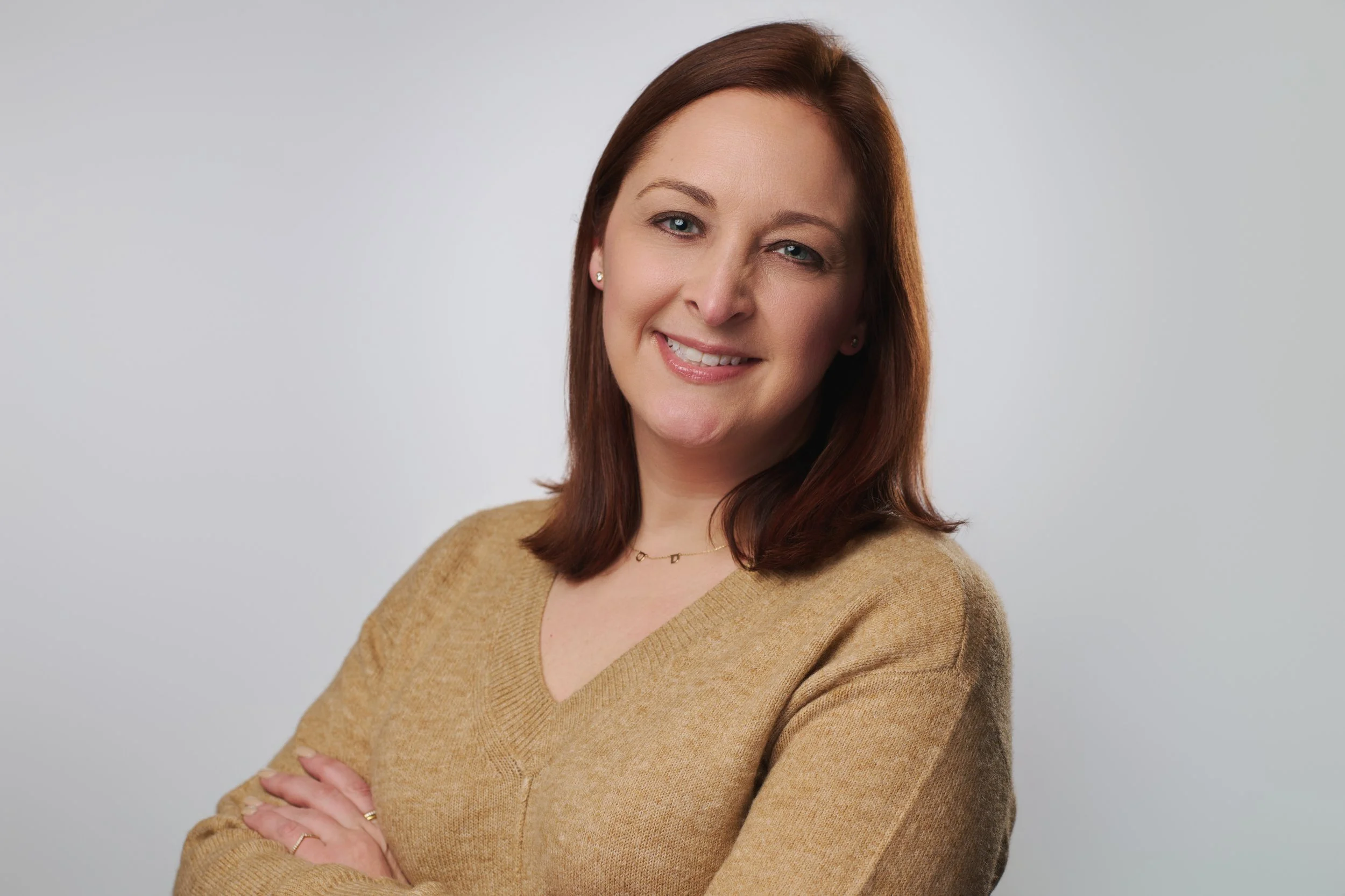 Nashville Headshot Photographer. Woman with arms folded for headshot