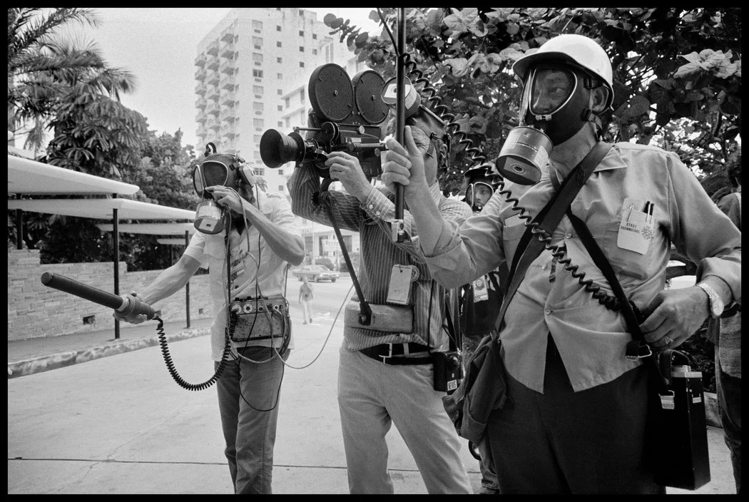 Even the television news crews had to wear gas masks for protection. Photographed by Abbas/Magnum.