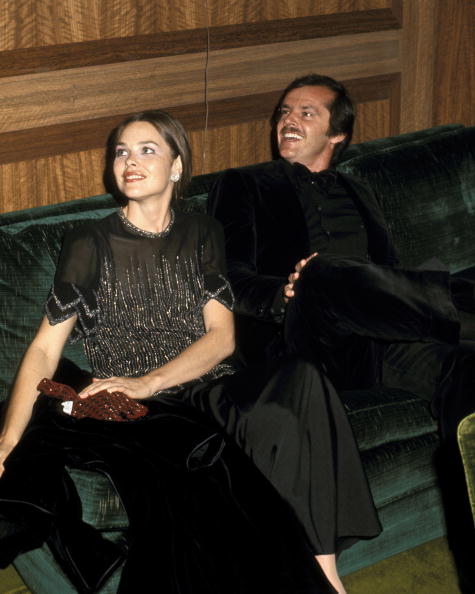 Wearing a simple 20s inspired beaded top and satin skirt, Michelle Phillips accompanies boyfriend Jack Nicholson to the 43rd Annual Academy Awards on April 15, 1971.