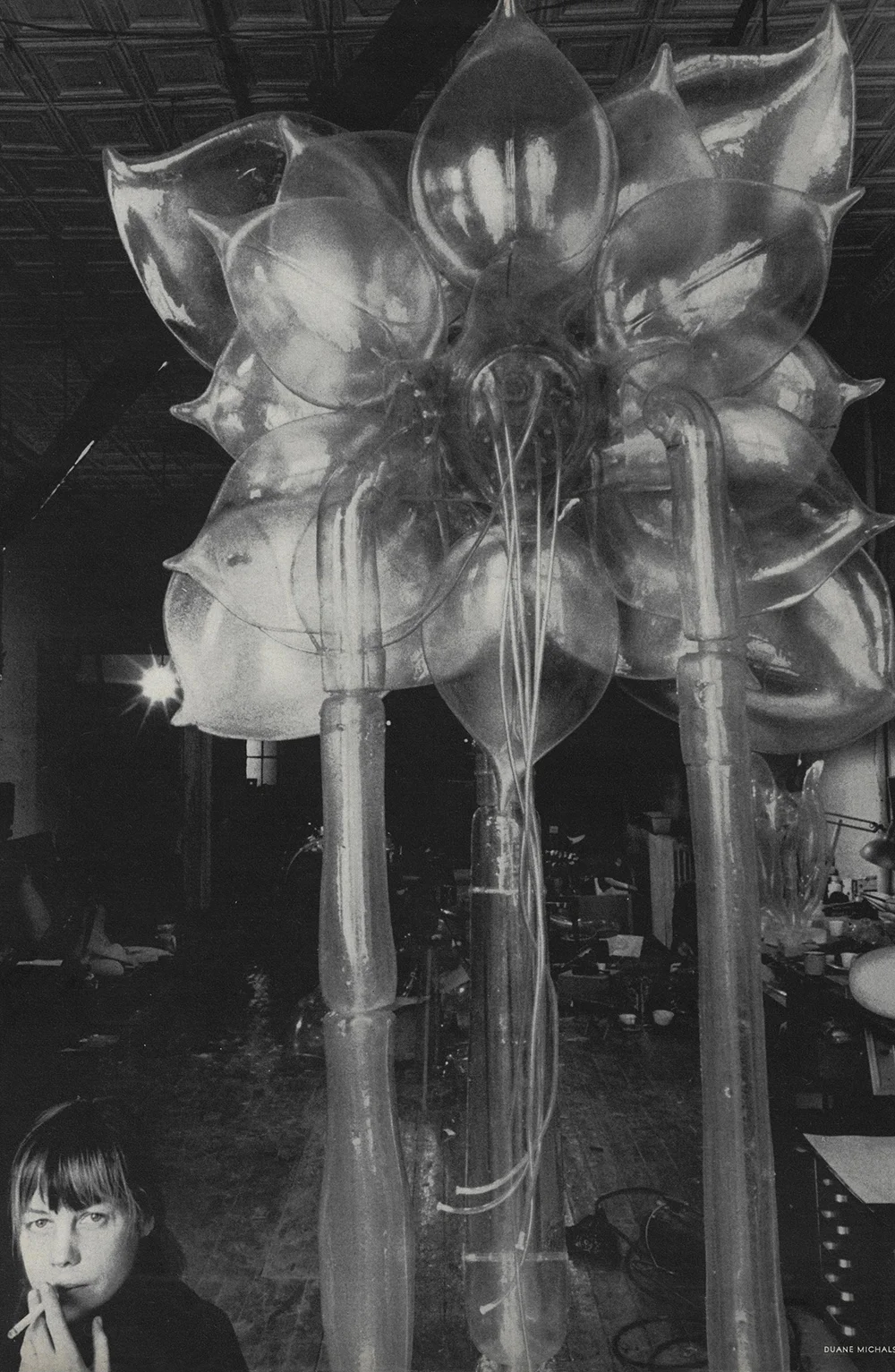 Lee Bontecou and one of her sculptures. Photo by Duane Michals for Vogue, May 1969.