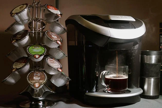 A Keurig machine with the real breadwinners - the k-cups.