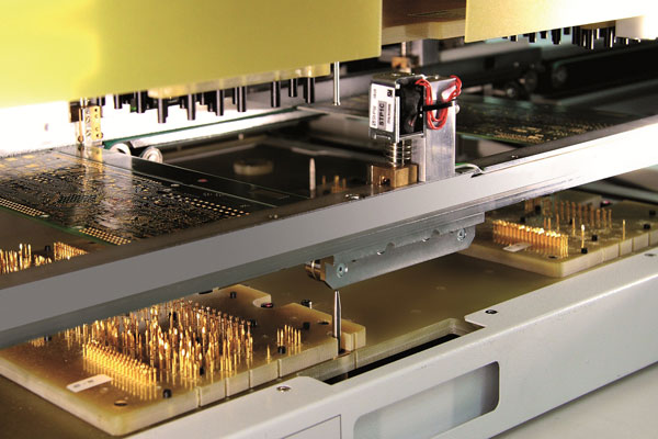 A bed of nails electronic test fixture ( source ).