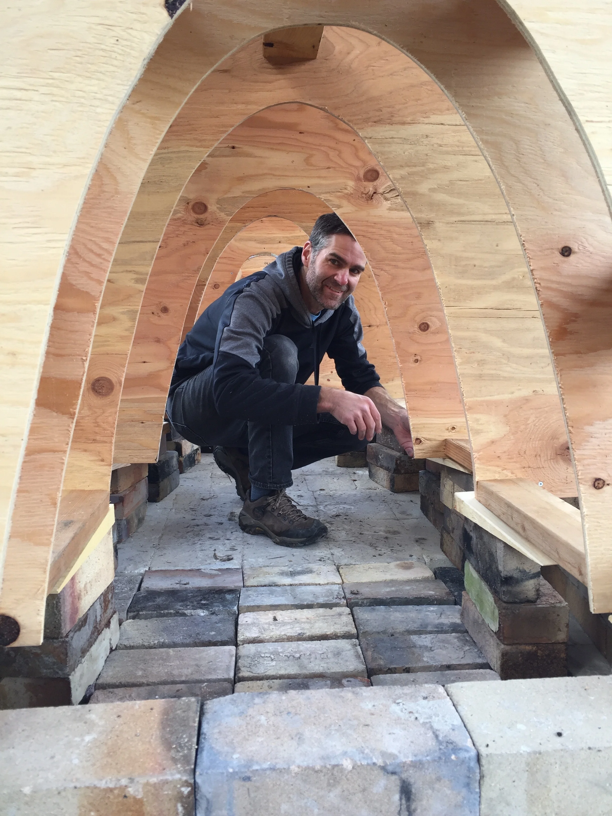 Placing wedges under the arch former ribs. I was a bit worried that they weren't a steep enough angle. But it worked out.